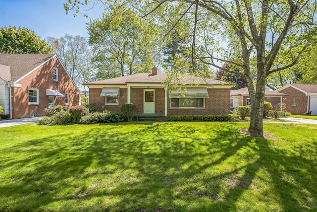13970 Crosley, Redford, MI 48239 - view of front of house featuring brick siding, a chimney, a front lawn, and concrete driveway