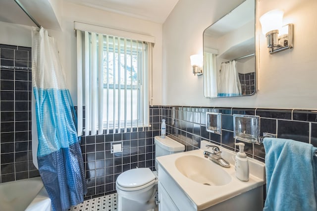 13970 Crosley, Redford, MI 48239 - full bath with tile walls, toilet, vanity, wainscoting, and shower / bath combo with shower curtain