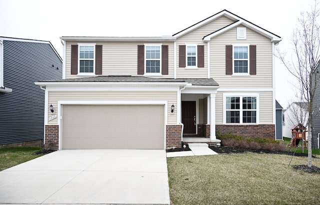view of front of property featuring a garage, driveway, brick siding, and a front yard