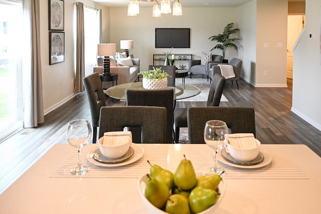 dining space with dark wood-style floors and baseboards