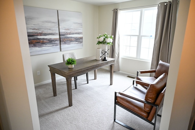 carpeted home office with baseboards