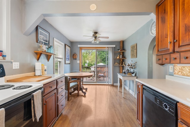 kitchen featuring electric range oven, dishwasher, light countertops, light wood finished floors, and brown cabinets