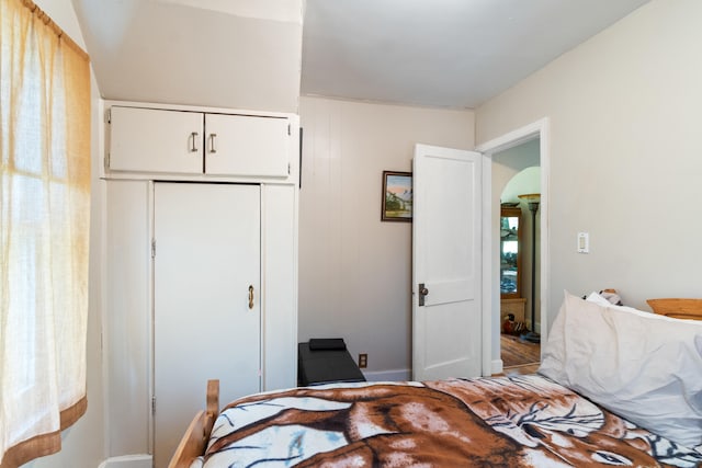bedroom featuring a closet and baseboards