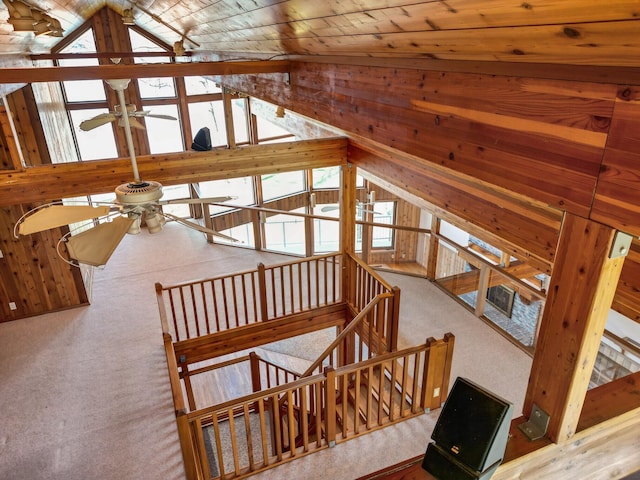 14427 Acorn Cove Trl, Battle Creek, MI 49017 - staircase featuring ceiling fan, vaulted ceiling, healthy amount of natural light, wooden ceiling, and carpet flooring