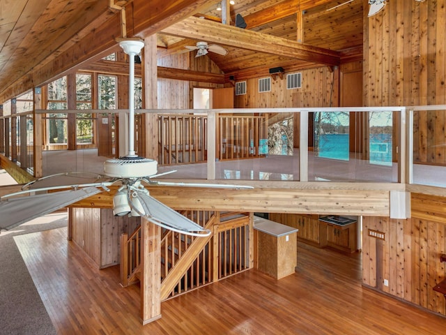 14427 Acorn Cove Trl, Battle Creek, MI 49017 - interior space with a ceiling fan, wooden walls, wooden ceiling, and wood finished floors