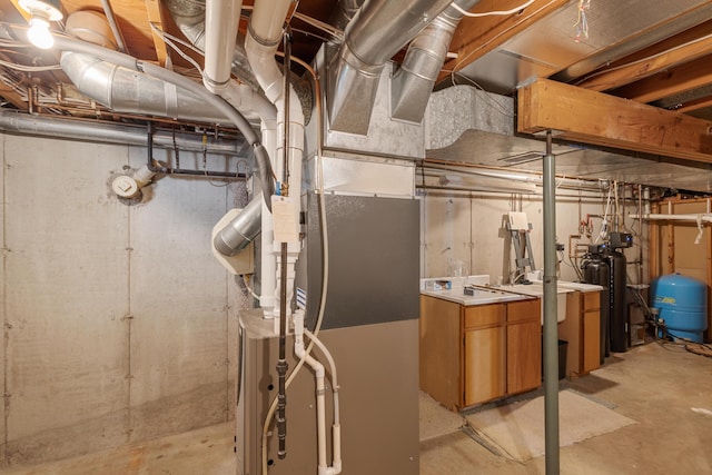 14427 Acorn Cove Trl, Battle Creek, MI 49017 - unfinished basement featuring a water pressure tank and heating unit