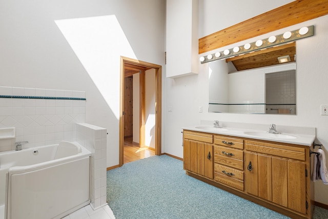 14427 Acorn Cove Trl, Battle Creek, MI 49017 - full bathroom with double vanity, a bath, and carpet flooring