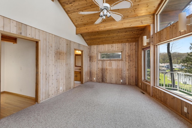 14427 Acorn Cove Trl, Battle Creek, MI 49017 - unfurnished room featuring wood walls, ceiling fan, wood ceiling, carpet, and high vaulted ceiling