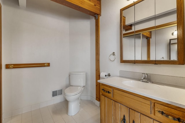 14427 Acorn Cove Trl, Battle Creek, MI 49017 - half bath with toilet, baseboards, vanity, and tile patterned floors