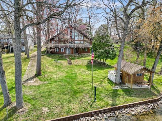 14427 Acorn Cove Trl, Battle Creek, MI 49017 - view of grassy yard featuring an outdoor structure and a water view