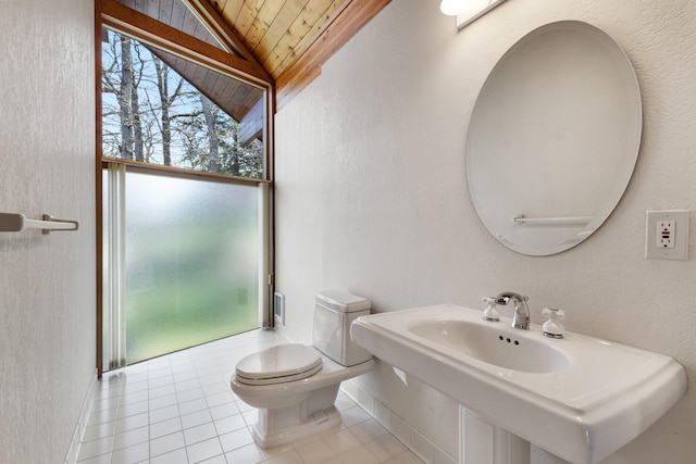 14427 Acorn Cove Trl, Battle Creek, MI 49017 - half bathroom with wooden ceiling, lofted ceiling, toilet, tile patterned floors, and a sink
