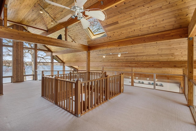14427 Acorn Cove Trl, Battle Creek, MI 49017 - corridor featuring rail lighting, carpet flooring, wood ceiling, a skylight, and an upstairs landing