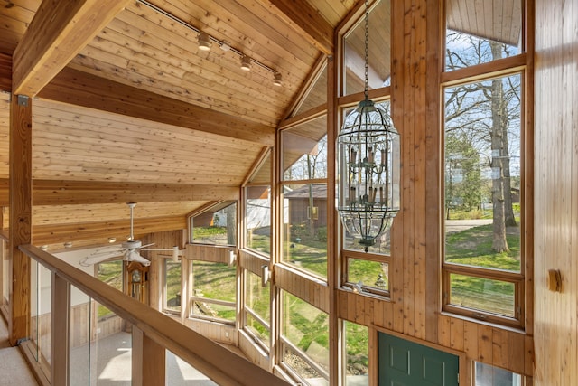 14427 Acorn Cove Trl, Battle Creek, MI 49017 - detailed view of track lighting, wood ceiling, wooden walls, beamed ceiling, and a ceiling fan