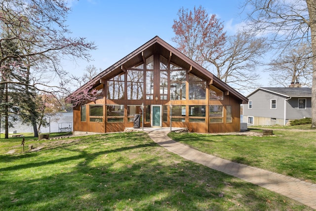 14427 Acorn Cove Trl, Battle Creek, MI 49017 - back of house featuring a lawn and a sunroom