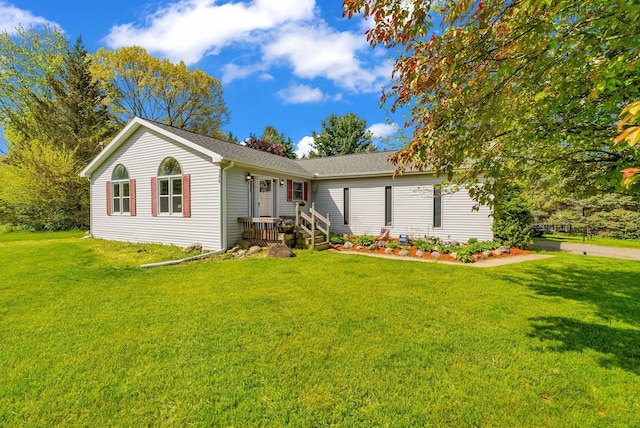 144 Westshore Dr, Jerome, MI 49249 - ranch-style house with a front yard and a shingled roof