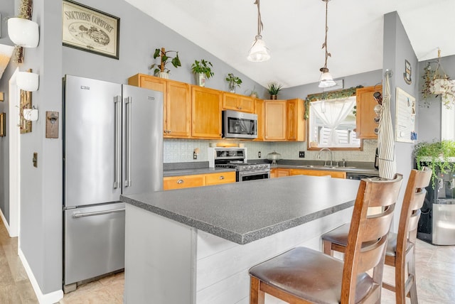 144 Westshore Dr, Jerome, MI 49249 - kitchen with stainless steel appliances, lofted ceiling, a sink, tasteful backsplash, and dark countertops