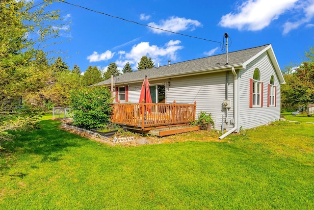 144 Westshore Dr, Jerome, MI 49249 - back of house featuring a wooden deck and a yard