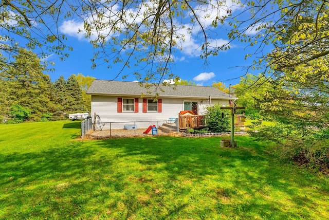 144 Westshore Dr, Jerome, MI 49249 - rear view of property featuring a yard and a wooden deck