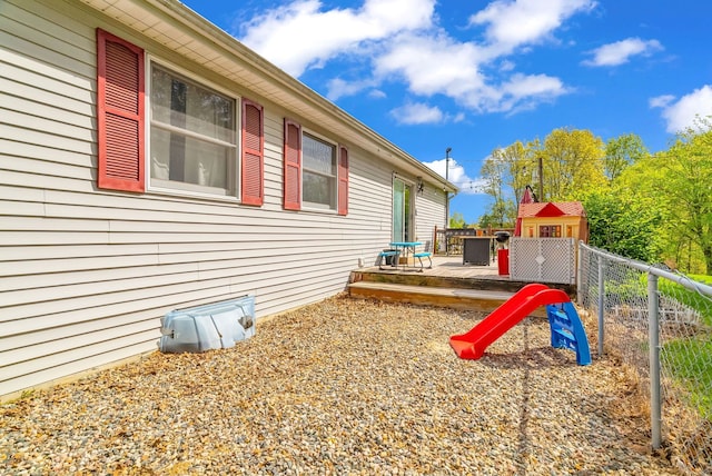 144 Westshore Dr, Jerome, MI 49249 - view of side of property featuring a deck and fence