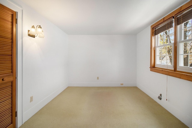 805 E Filer St, Ludington, MI 49431 - empty room featuring light colored carpet