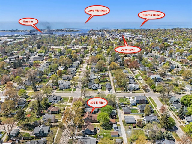 805 E Filer St, Ludington, MI 49431 - aerial overview of property's location featuring a large body of water and nearby suburban area