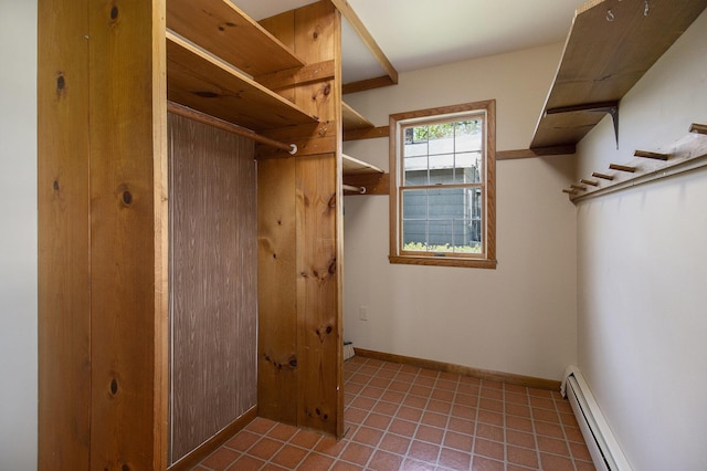 805 E Filer St, Ludington, MI 49431 - walk in closet featuring baseboard heating and tile patterned flooring