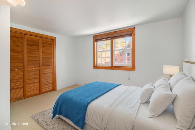 805 E Filer St, Ludington, MI 49431 - carpeted bedroom with a closet