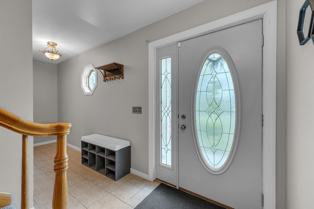 17035 Weber Rd, Holly, MI 48442 - foyer with light tile patterned floors and baseboards