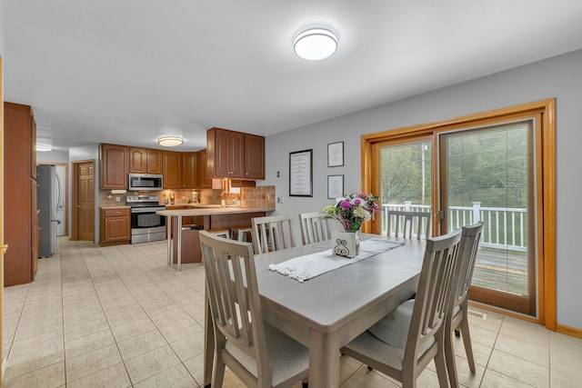 17035 Weber Rd, Holly, MI 48442 - dining room featuring light tile patterned floors