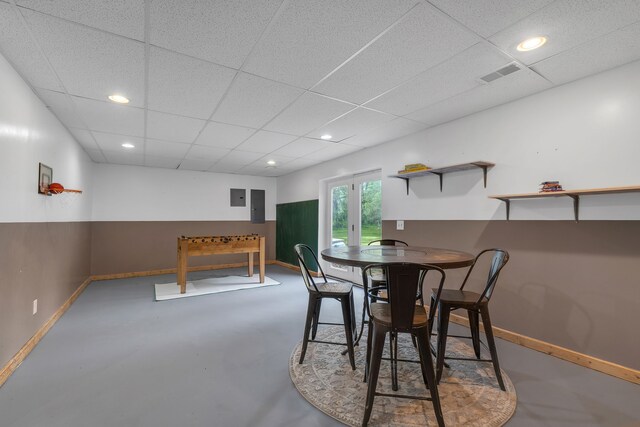 17035 Weber Rd, Holly, MI 48442 - dining area featuring baseboards, electric panel, a drop ceiling, finished concrete flooring, and recessed lighting