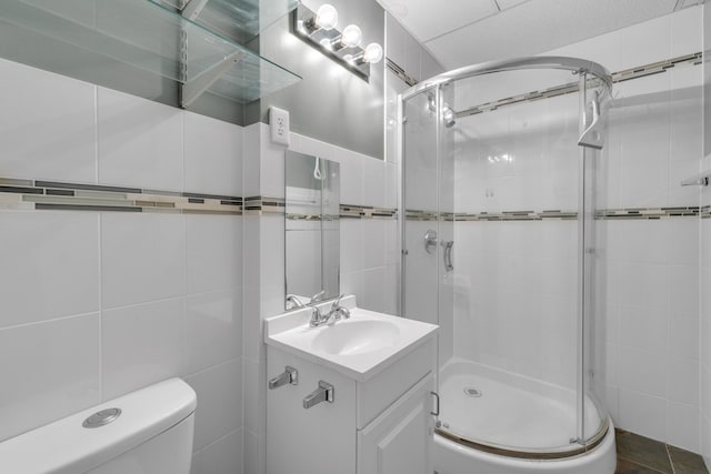 17035 Weber Rd, Holly, MI 48442 - full bath featuring a stall shower, tile walls, toilet, and vanity