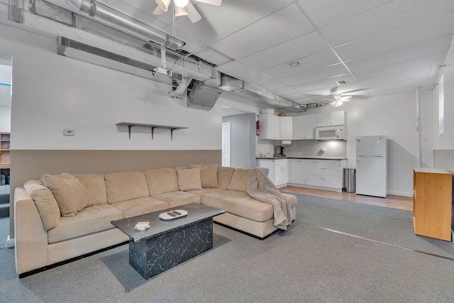 17035 Weber Rd, Holly, MI 48442 - living room featuring ceiling fan and light colored carpet