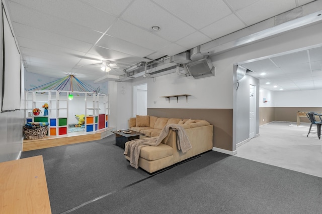 17035 Weber Rd, Holly, MI 48442 - carpeted living room featuring a drop ceiling, ceiling fan, and baseboards