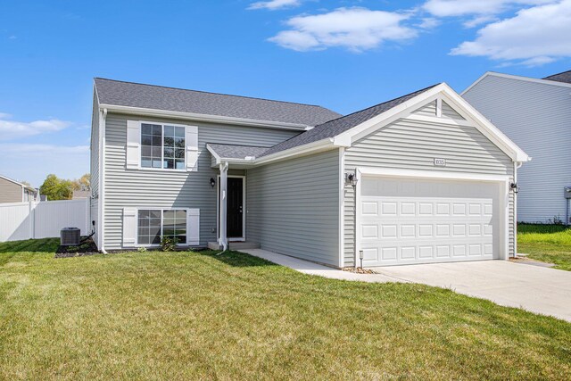 10315 Hatch Ln, Galesburg, MI 49053 - tri-level home with central air condition unit, concrete driveway, a garage, and roof with shingles