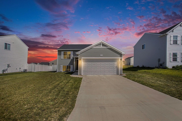 10315 Hatch Ln, Galesburg, MI 49053 - view of front of property featuring an attached garage, driveway, and cooling unit