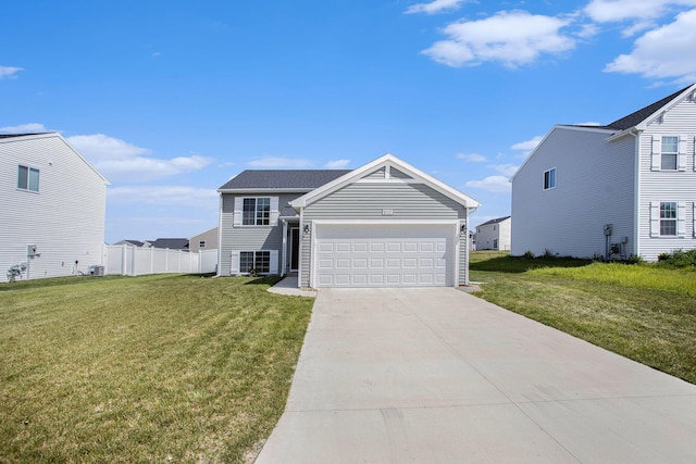 10315 Hatch Ln, Galesburg, MI 49053 - view of front of home with a garage, driveway, and central AC unit