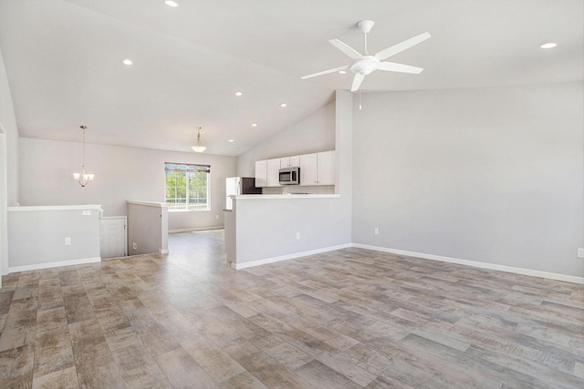 10315 Hatch Ln, Galesburg, MI 49053 - unfurnished living room featuring light wood-type flooring, a chandelier, recessed lighting, ceiling fan, and baseboards