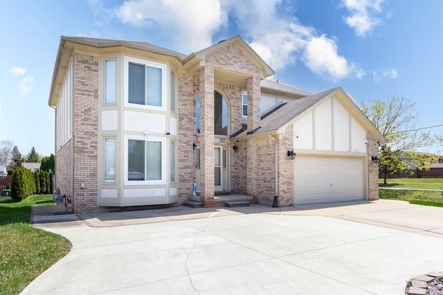 view of front of home with brick siding, concrete driveway, and a garage