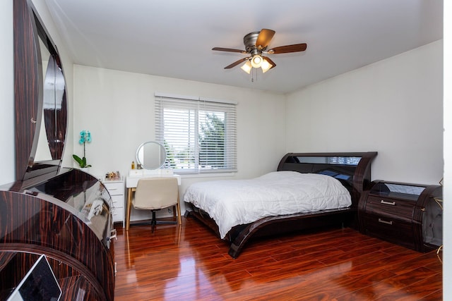 bedroom featuring wood finished floors and ceiling fan