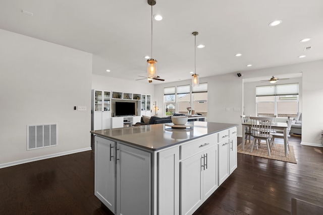 4051 Colfax Ct, Canton, MI 48188 - kitchen with a ceiling fan, a kitchen island, open floor plan, dark wood-style floors, and recessed lighting
