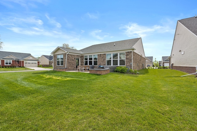 4051 Colfax Ct, Canton, MI 48188 - back of house featuring brick siding, a patio area, a lawn, a garage, and a shingled roof