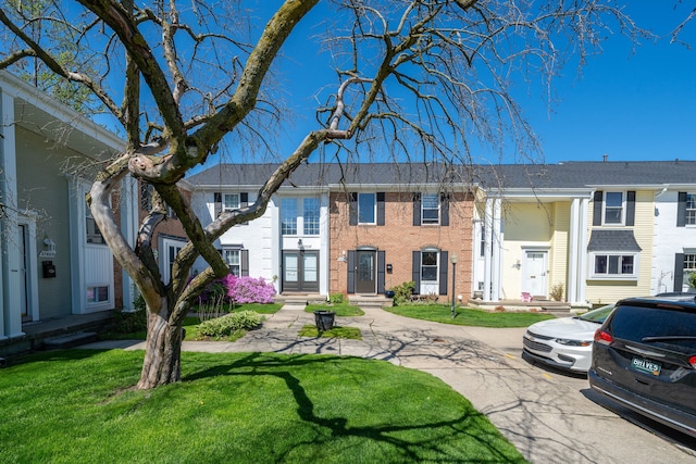 37475 Charter Oaks Blvd, Clinton Township, MI 48036 - townhome / multi-family property featuring a front lawn and brick siding