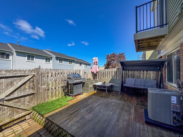 37475 Charter Oaks Blvd, Clinton Township, MI 48036 - wooden terrace with a grill, cooling unit, fence, and outdoor lounge area