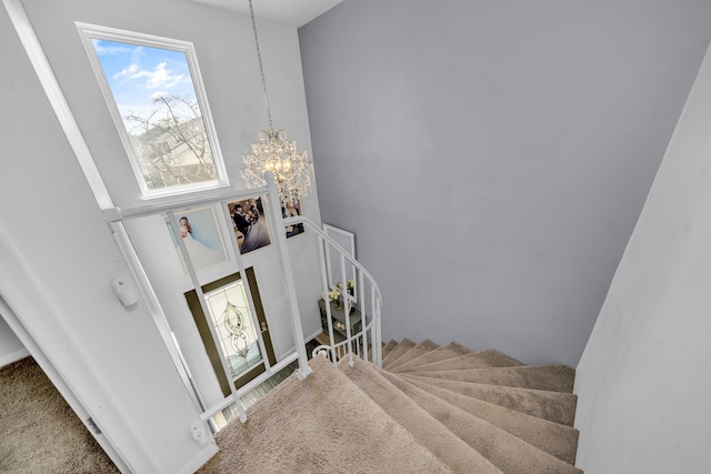 37475 Charter Oaks Blvd, Clinton Township, MI 48036 - staircase with a chandelier and carpet flooring