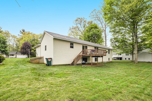 4754 Oaklane Dr, Hudsonville, MI 49426 - rear view of house with a deck, stairway, and a lawn