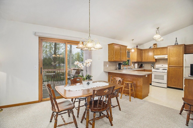 4754 Oaklane Dr, Hudsonville, MI 49426 - dining room with light carpet, vaulted ceiling, and a chandelier