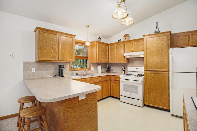 4754 Oaklane Dr, Hudsonville, MI 49426 - kitchen with white appliances, under cabinet range hood, a peninsula, tasteful backsplash, and vaulted ceiling
