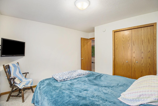 4754 Oaklane Dr, Hudsonville, MI 49426 - carpeted bedroom with baseboards and a closet