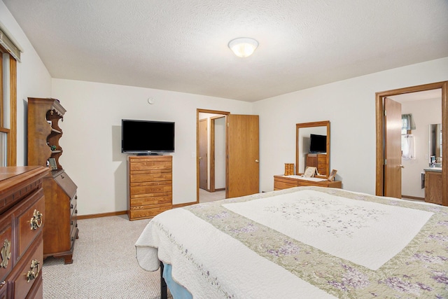 4754 Oaklane Dr, Hudsonville, MI 49426 - bedroom with light carpet, baseboards, and ensuite bathroom