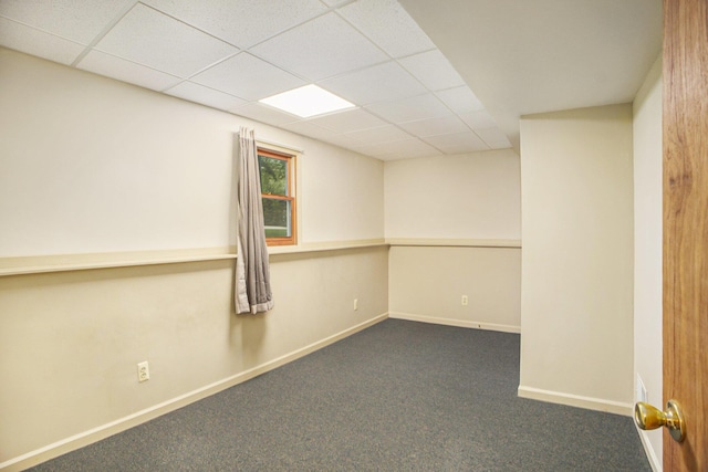4754 Oaklane Dr, Hudsonville, MI 49426 - empty room with a drop ceiling, dark colored carpet, and baseboards